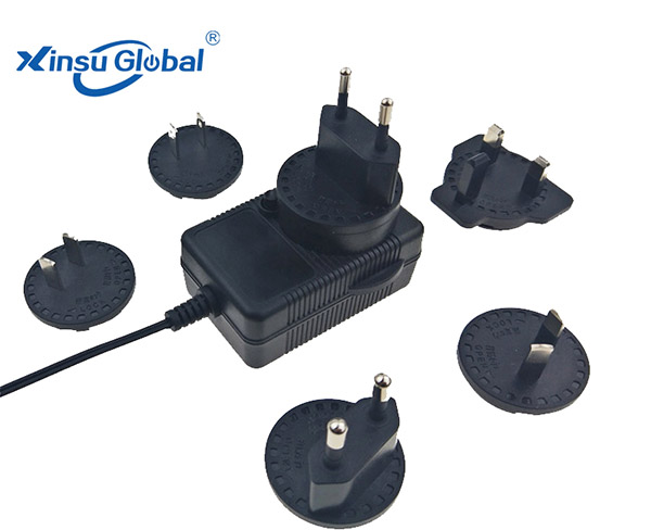 The interchangeable plug switching power supply charger